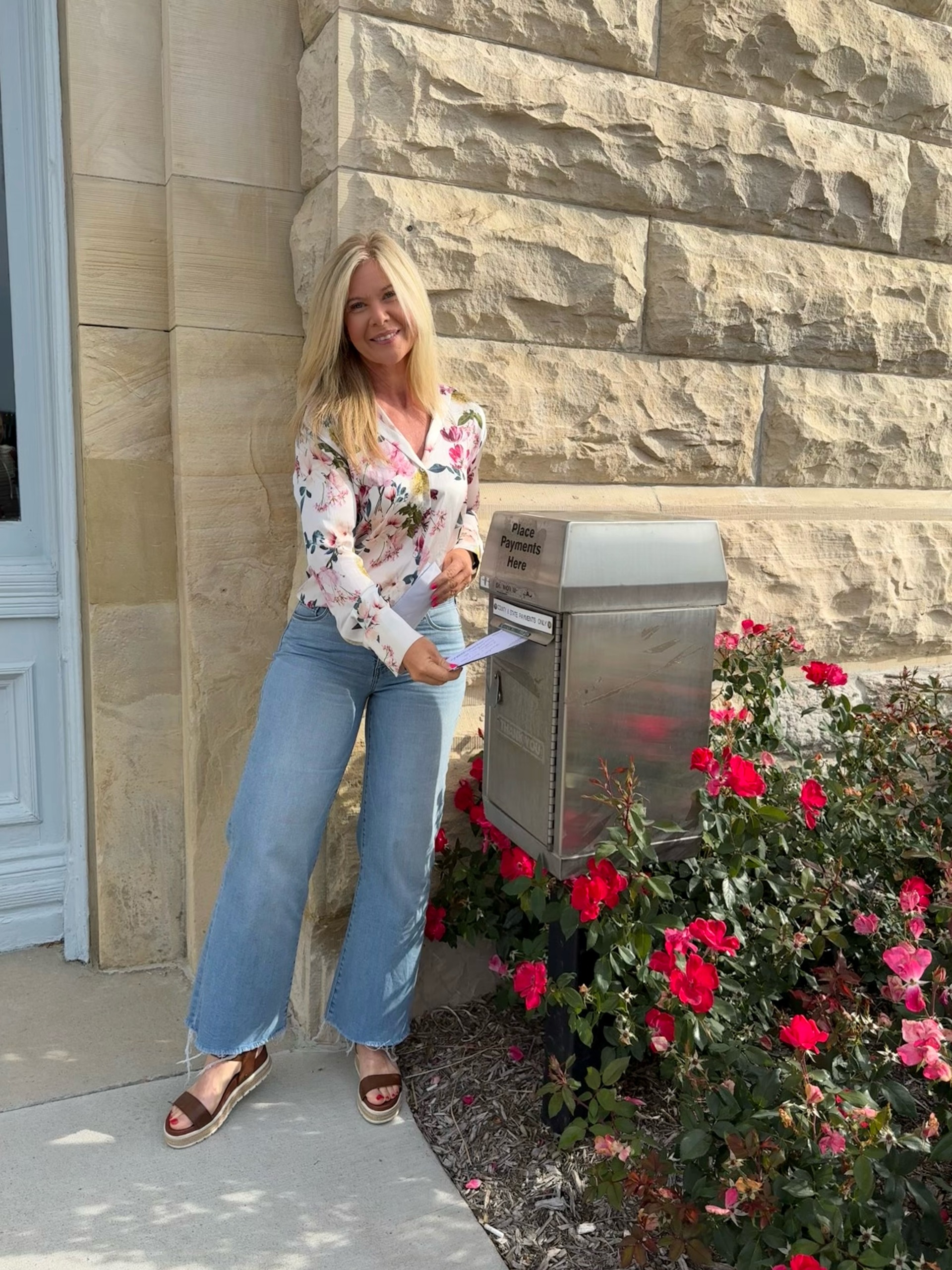 County Treasurer submitting a payment using the courthouse drop box.